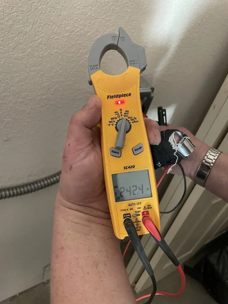 Voltage testing with clamp meter during Generator Installation in French Valley